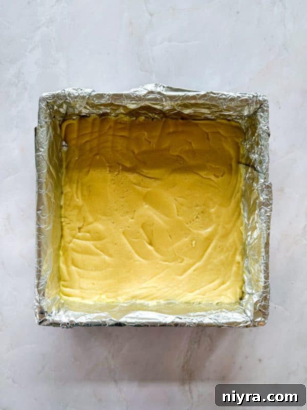 Chewy Coconut Macaroon Blondies 8 Pressing the blondie batter into the prepared baking pan