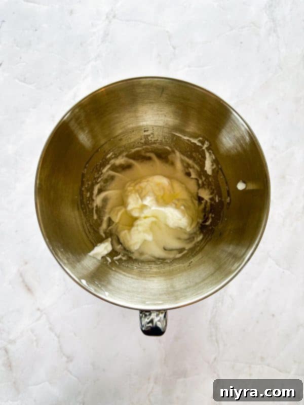 Chewy Coconut Macaroon Blondies 10 Adding beaten egg whites to the coconut mixture