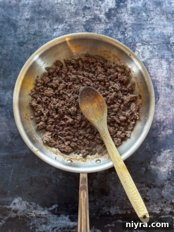 Step 1: Browning ground beef with Italian seasoning in a skillet.
