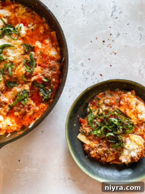 Skillet lasagna with a wooden spoon