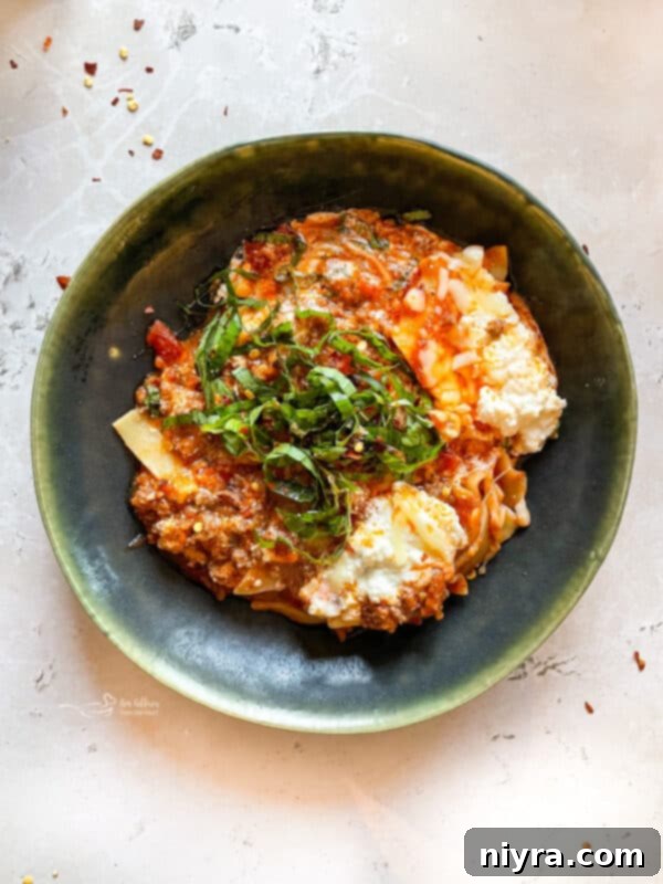 Skillet lasagna bubbling in a pan with cheese