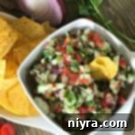 overhead of cucumber salsa in a white bowl