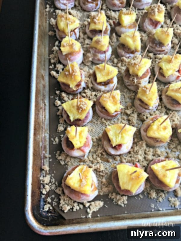 Pineapple pieces secured with toothpicks and a final dusting of brown sugar on the appetizers.