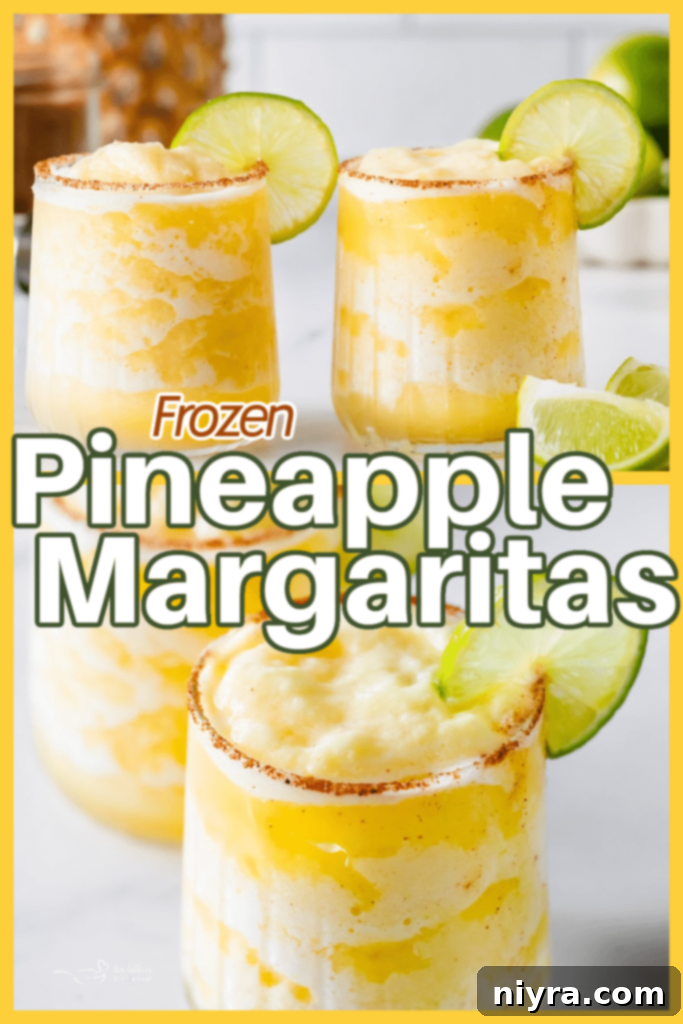 A vibrant Frozen Pineapple Margarita in a stemmed glass with a perfectly salted rim and lime garnish, inviting a refreshing sip.