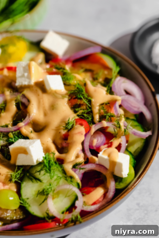 A fresh cucumber tomato salad with a focus on its vibrant colors and textures.