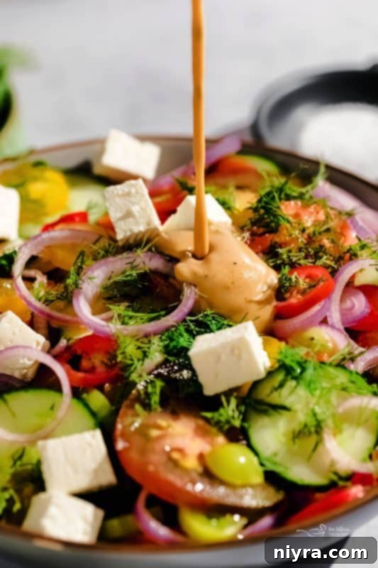 Step 3: Adding dill and feta to the salad before dressing.