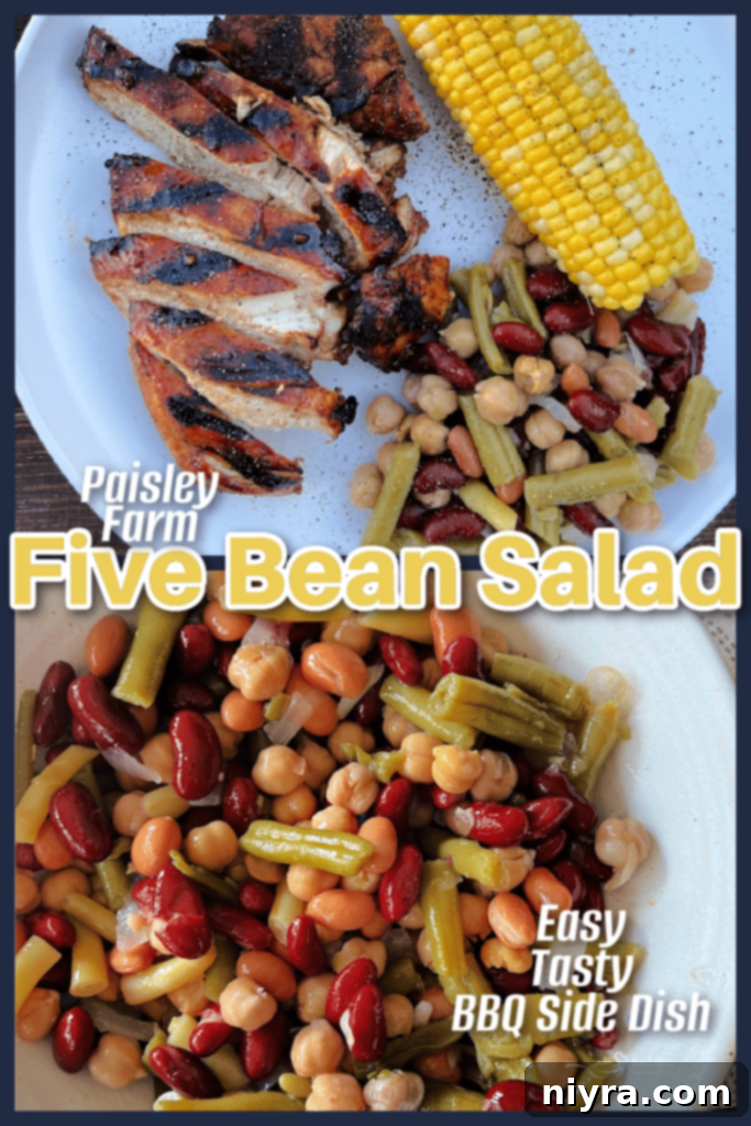 Paisley Farm Five Bean Salad jar with grilled chicken in the background.