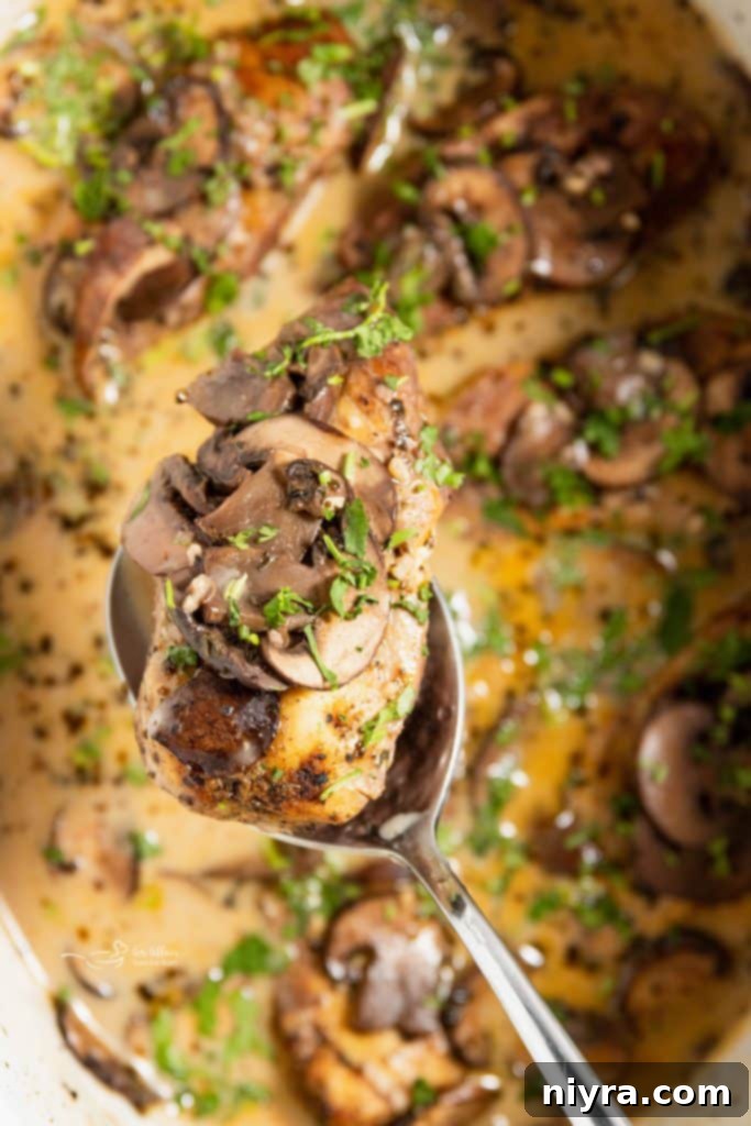 Easy Slow Cooker Chicken Marsala 2 Tender Crock Pot Chicken Marsala with mushrooms in a rich Marsala wine sauce, served on a plate