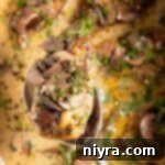 Easy Slow Cooker Chicken Marsala 18 Extreme close up of Marsala chicken on a spoon