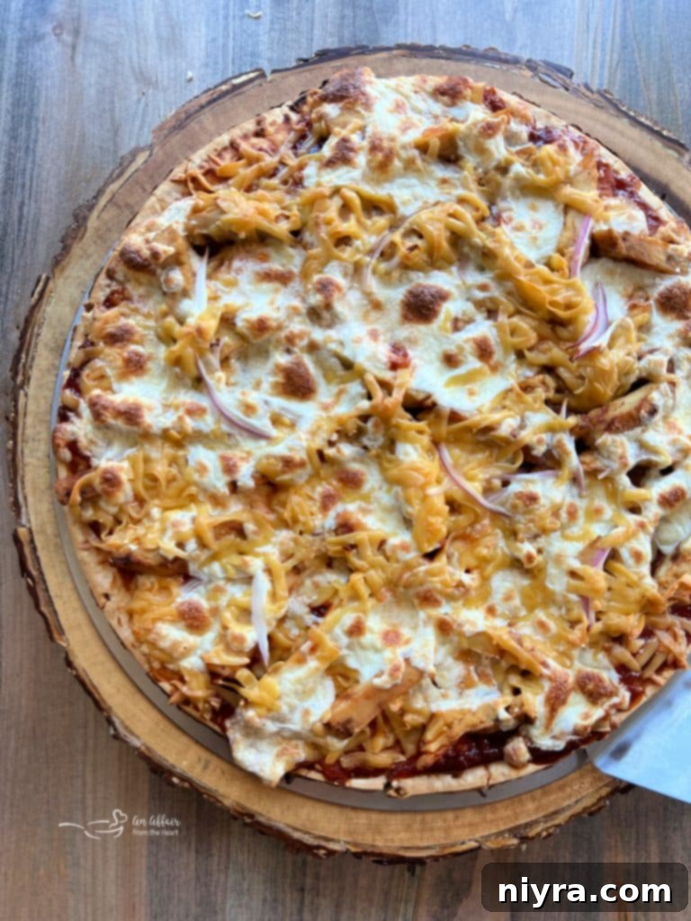 Close-up of a freshly grilled BBQ Chicken Pizza with kraut topping.