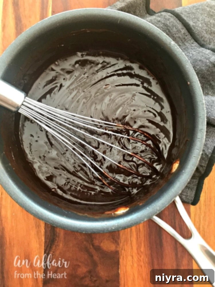 Perfect Chocolate Ganache Recipe 2 Silky smooth chocolate ganache in a bowl, ready to be poured