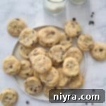 Overhead of Chocolate Chip Sugar Cookies and 2 glasses of milk