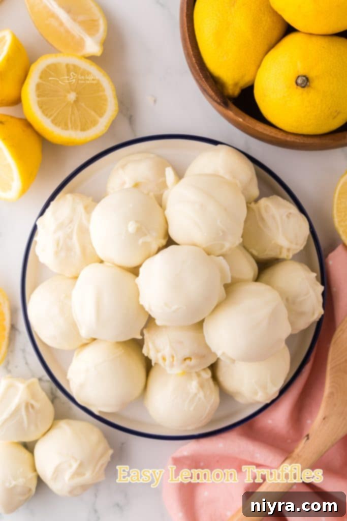 An assortment of white chocolate lemon truffles, some plain, some lightly decorated, ready to be enjoyed.