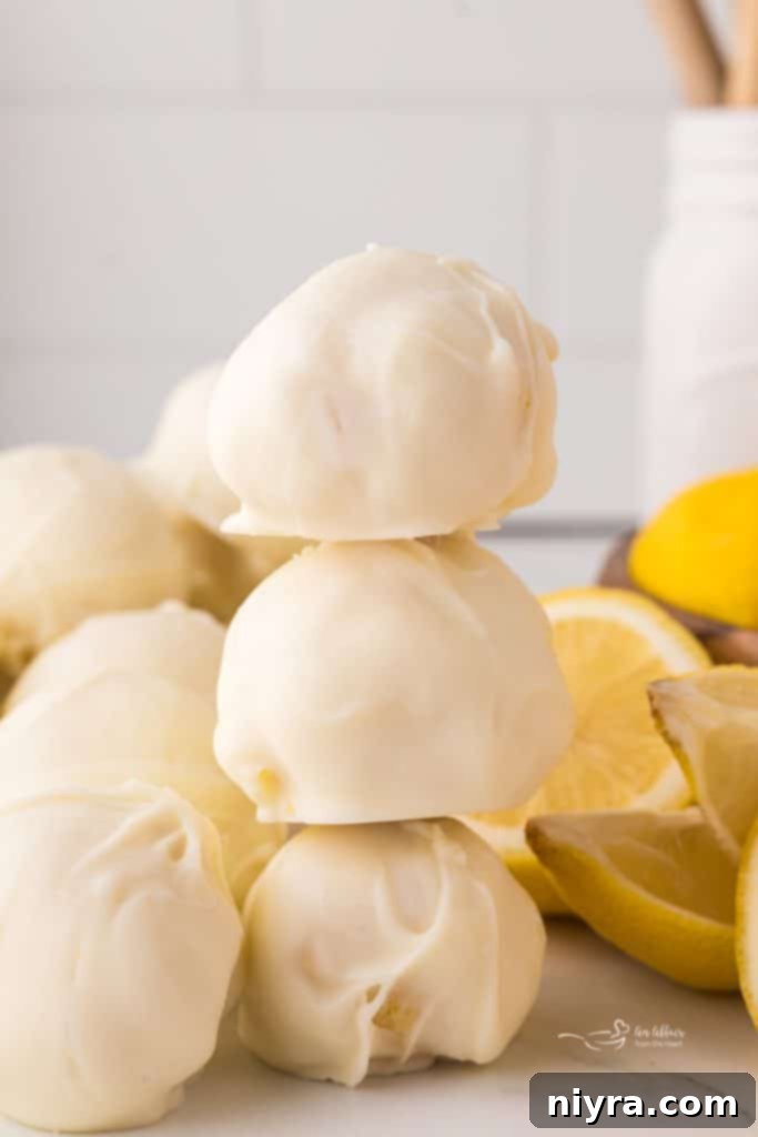 Another inviting image of lemon truffles, perhaps with a slight bite taken out of one to show the creamy interior.