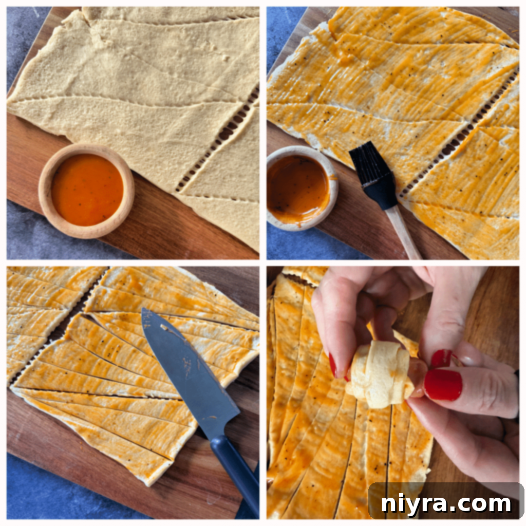 Step 1: Unrolling crescent dough and brushing it with Dorothy Lynch dressing on a parchment-lined baking sheet.