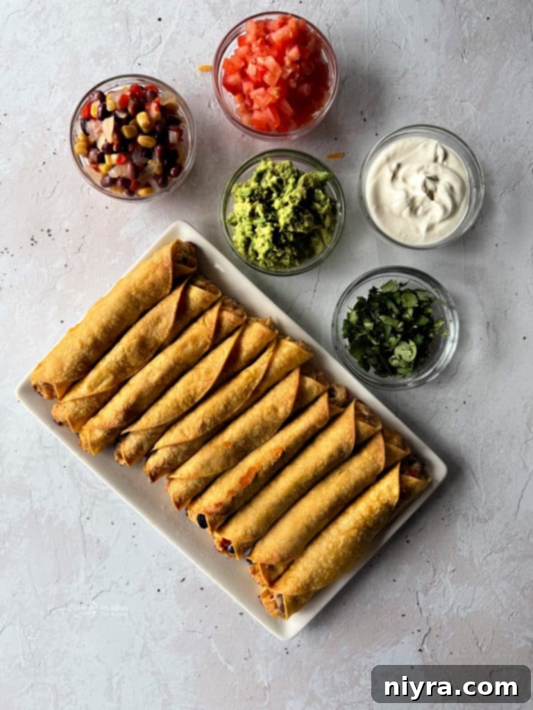 Freshly baked Chicken and Cowboy Caviar Taquitos, golden and crispy