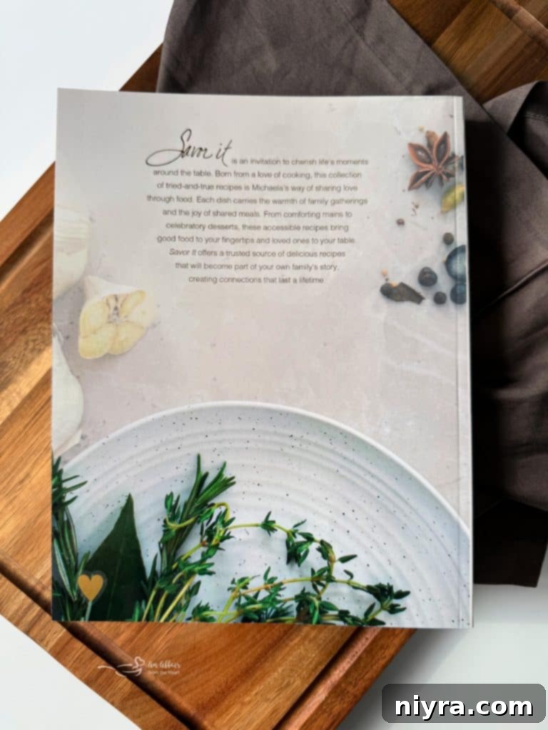 Savor It Cookbook open with ingredients and cooking tools
