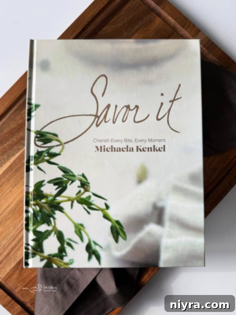 Smiling author with her Savor It cookbook