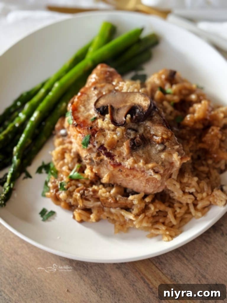 Tender No Peek Pork Chops and Rice, a comforting one-pan meal.