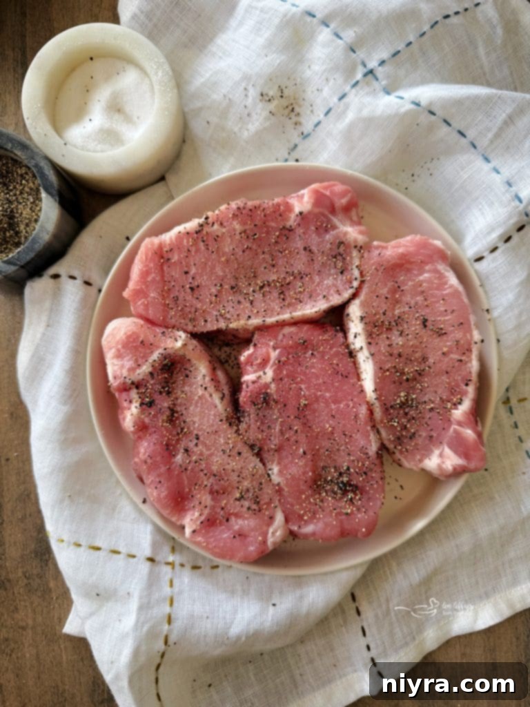 No Peek Pork Chops and Rice garnished with fresh parsley.