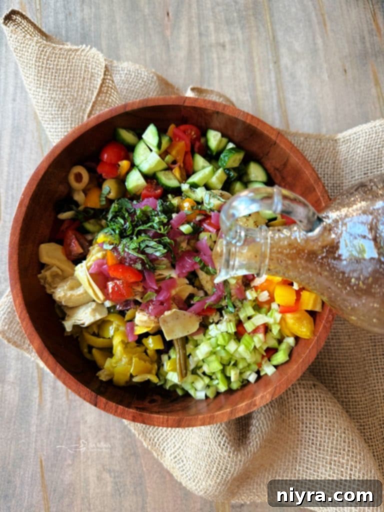 A vibrant Mediterranean Pickled Vegetable Salad, showcasing fresh and pickled components, with a rich dressing.
