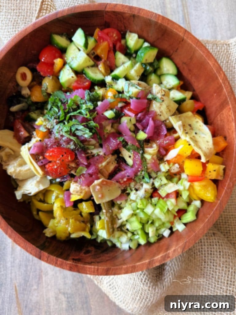 Third step: pouring the dressing over the mixed vegetables.