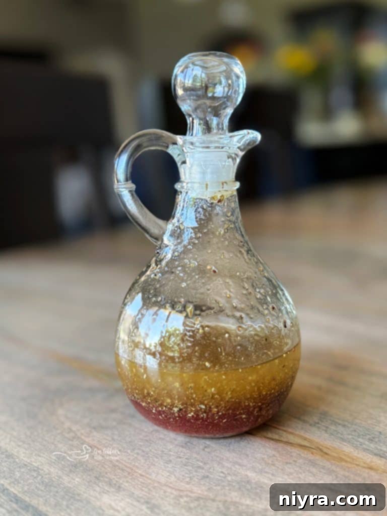 Homemade Mediterranean Dressing being prepared, with olive oil and herbs visible.