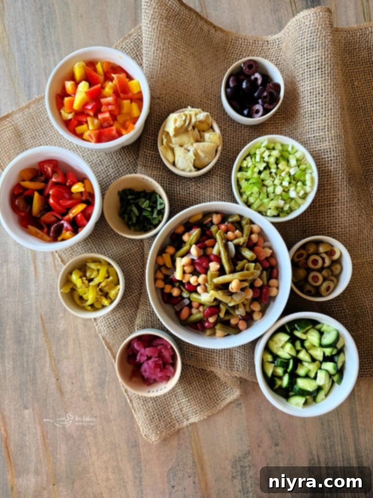 Individual ingredients like olives, peppers, and beans in small bowls.