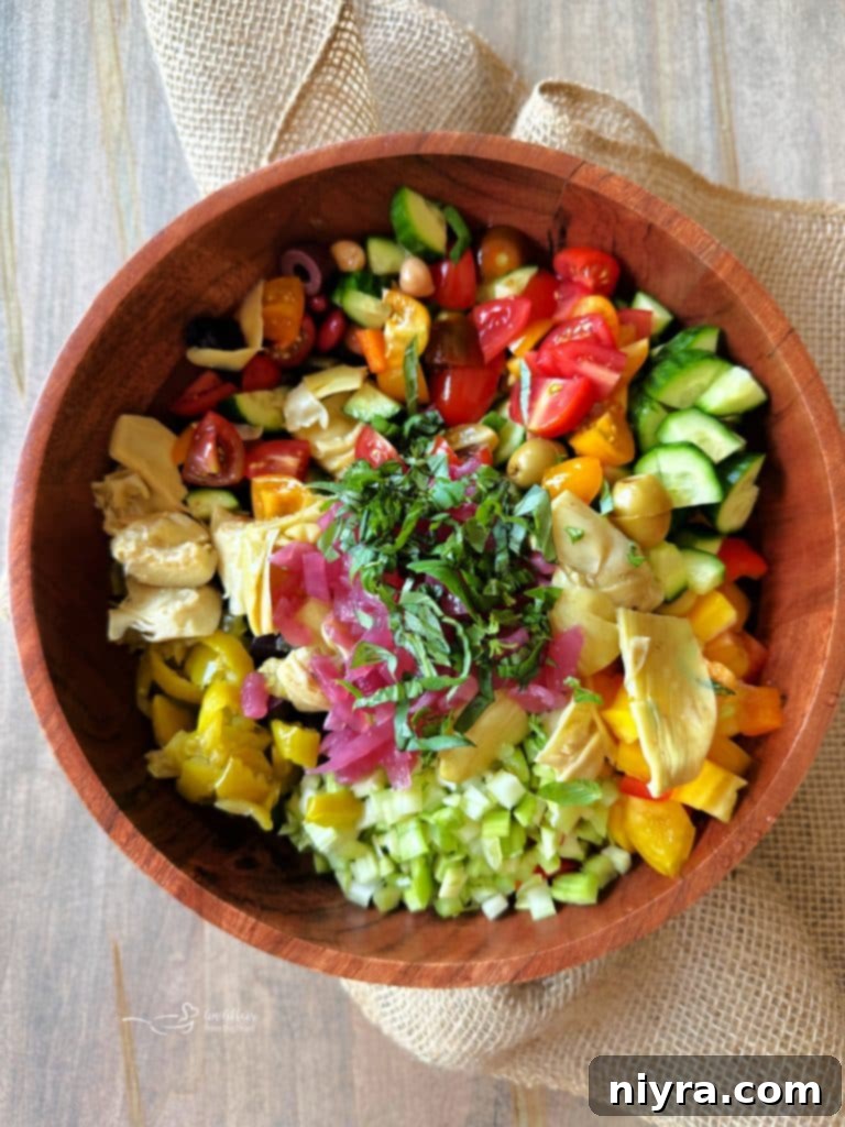 Second step: combining all the fresh and pickled vegetables in a large bowl.