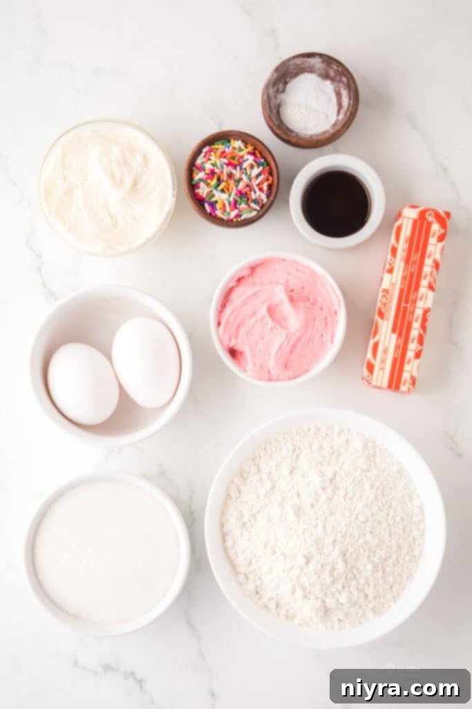 Frosted Sugar Cookie Delights 4 Close-up of a sugar cookie cup with a vibrant swirl of pink and white frosting and colorful sprinkles.