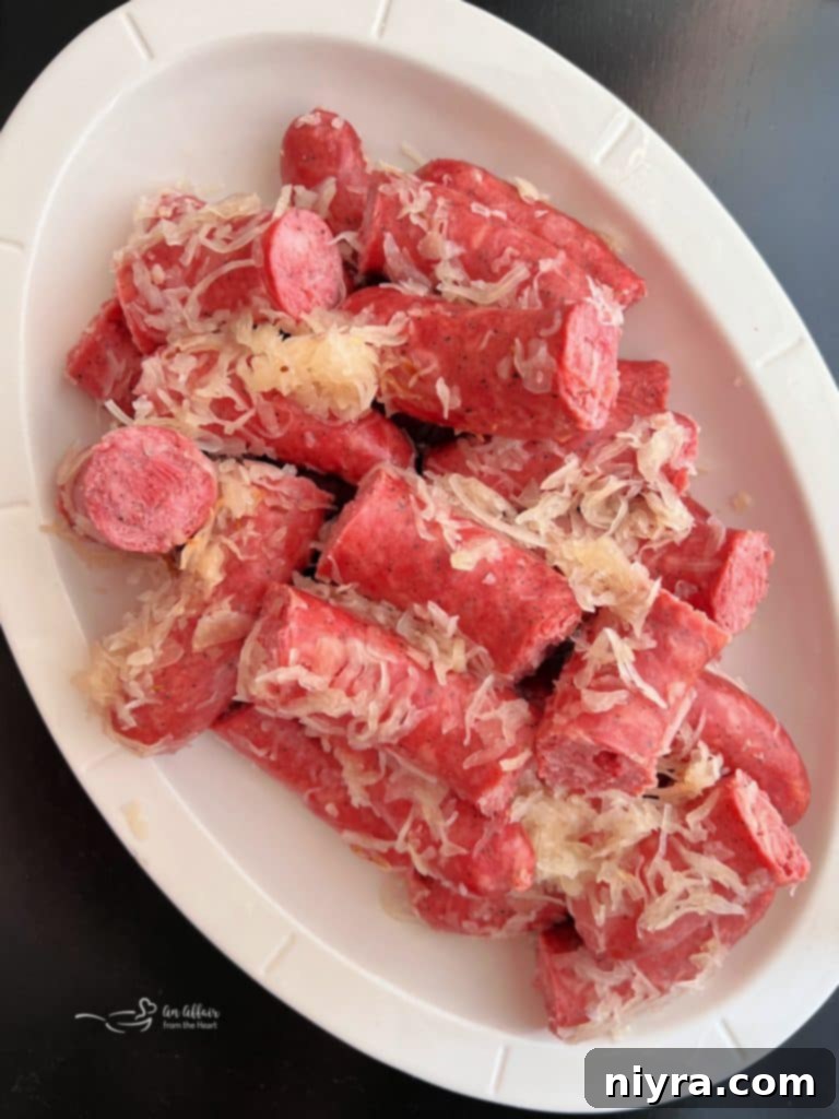 Polish Sausage & Sauerkraut in a white serving dish