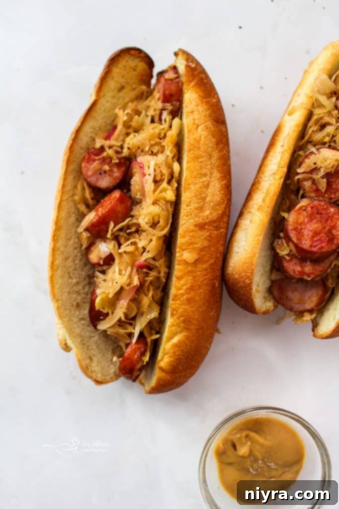 Close-up of a single Kielbasa and Sauerkraut Hoagie with parsley garnish