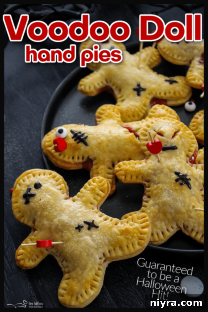 Several Voodoo Doll Hand Pies with black icing details