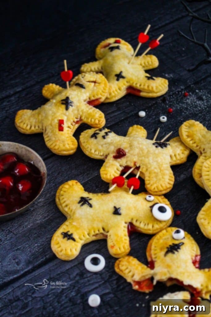 A tray of Voodoo Doll Hand Pies ready for the oven