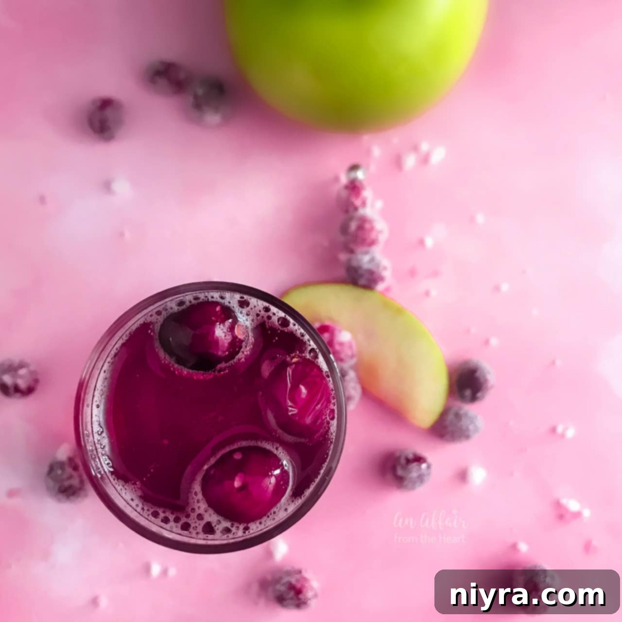 An overhead shot of the CranApple Fizz Cocktail, adorned with festive garnishes, highlighting its appeal.