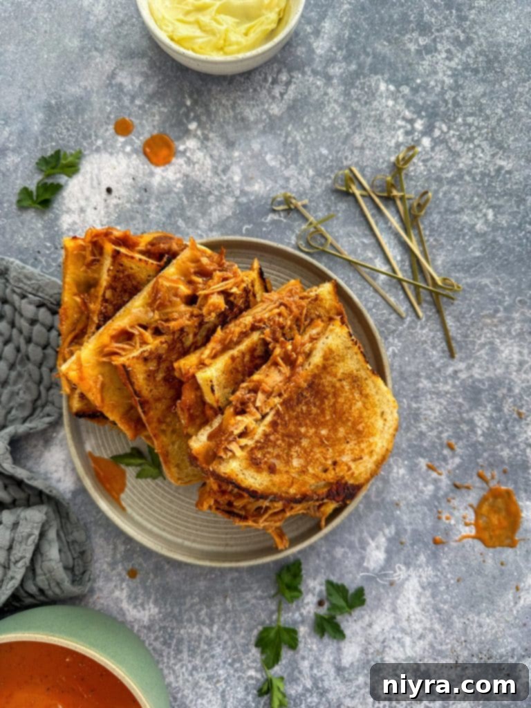 Ingredients for Pulled Pork Grilled Cheese: slices of sourdough bread, pulled pork, gouda cheese, and butter.