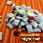 Pumpkin Spice Muddy Buddies on a striped table cloth