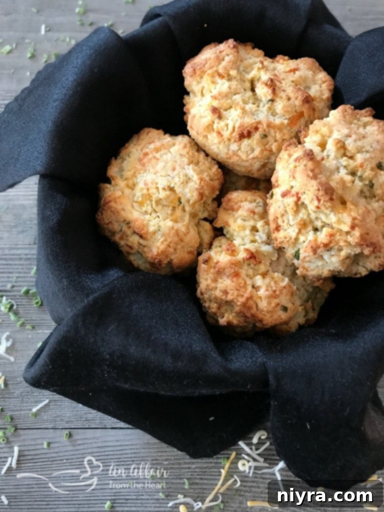 Golden brown Cheesy Cornbread Drop Biscuits on a baking sheet, ready to be served