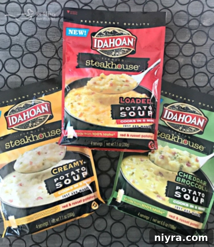 Delicious Cheesy Cornbread Drop Biscuits served alongside a creamy potato soup, garnished with herbs