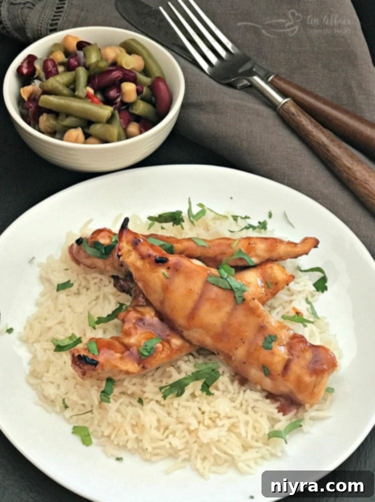 Finished Apricot BBQ Glazed Chicken served with rice and cilantro.
