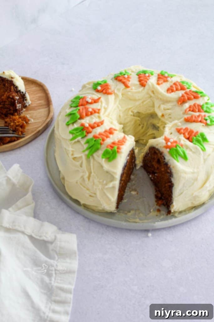 Slice of Carrot Bundt Cake with Cream Cheese Frosting on a plate