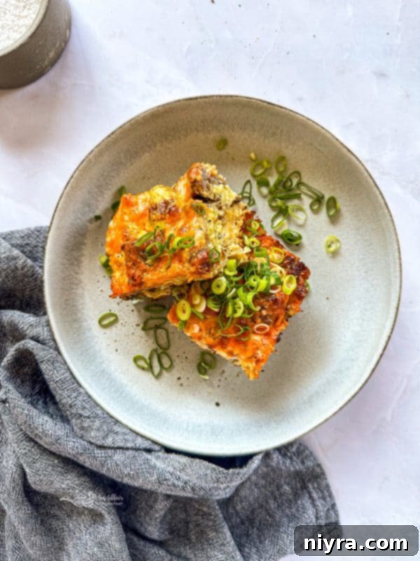 Golden Sausage Crescent Roll Bake 2 Sausage and Crescent Breakfast Casserole Bake sliced on a plate