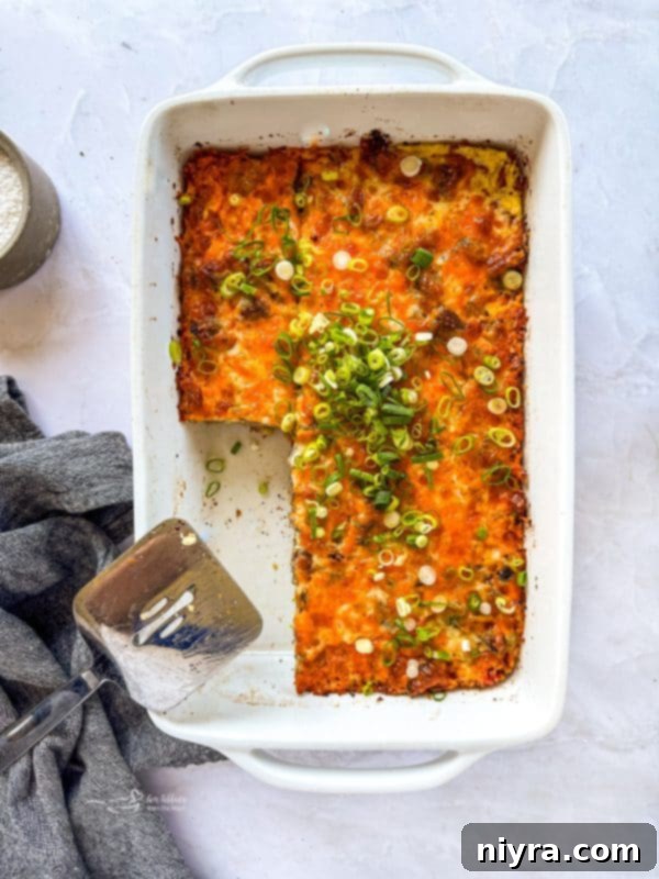 Golden Sausage Crescent Roll Bake 16 Sausage and Crescent Breakfast Casserole Bake garnished with scallions