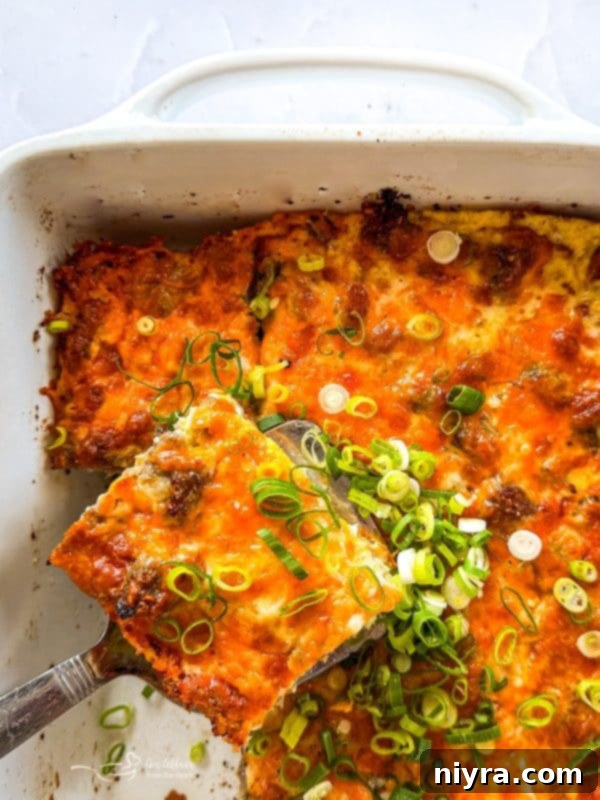 Golden Sausage Crescent Roll Bake 19 Sausage and Crescent Breakfast Bake with a spoon