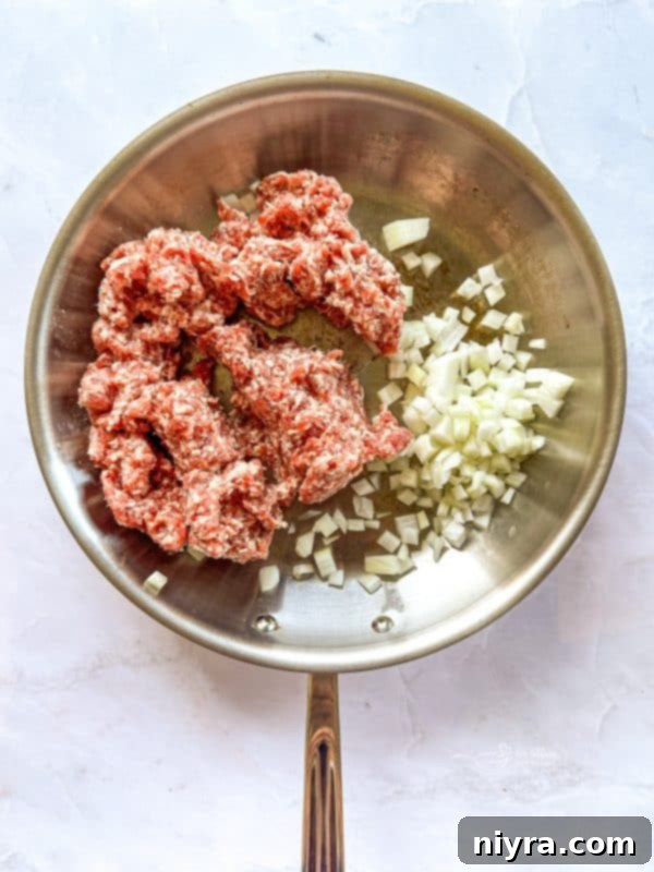 Golden Sausage Crescent Roll Bake 8 Browning sausage with onions