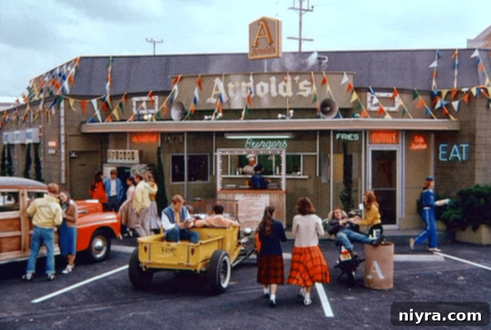 Happy Days TV show character, Fonz, next to a classic car at Arnold's Diner.