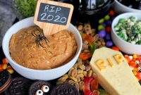 Spooky Sweet and Savory Halloween Snack Board with Peanut Butter Dip
