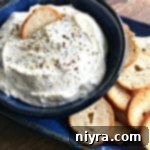 Everything Bagel Dip in a blue bowl