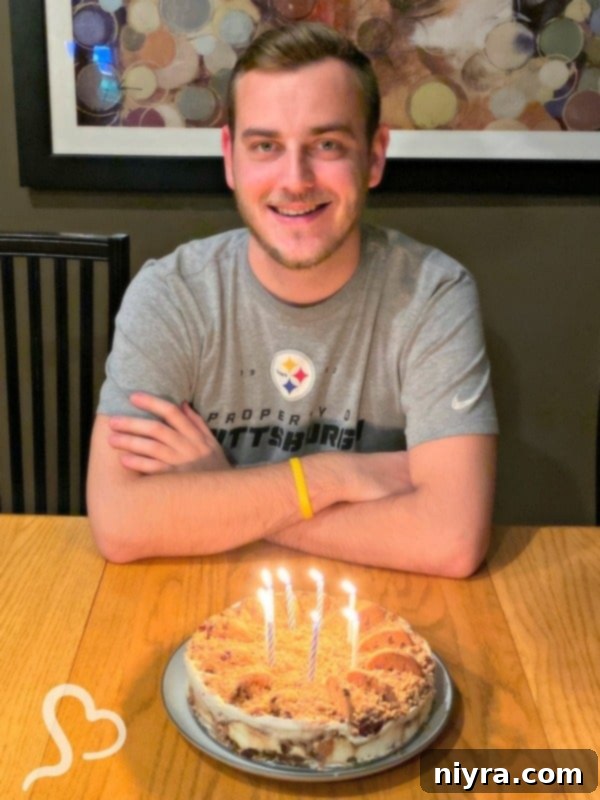Spencer on his 25th birthday with the new chocolate chip cookie dough ice cream cake.