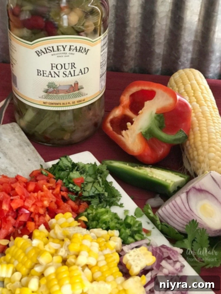 Zesty Mexican Four Bean Salad 5 Mexican Four Bean Salad prepared in a white bowl with fresh garnishes